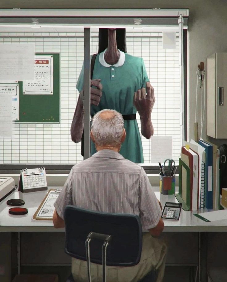 an old man sitting in front of a desk with a mannequin on it