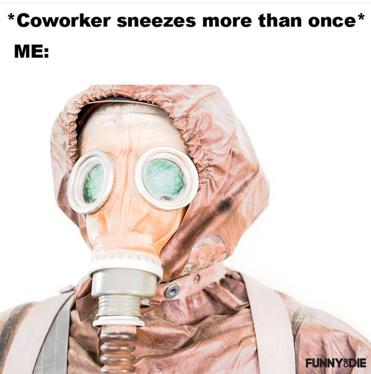 a man wearing a gas mask with the caption coworker sneezes more than once me