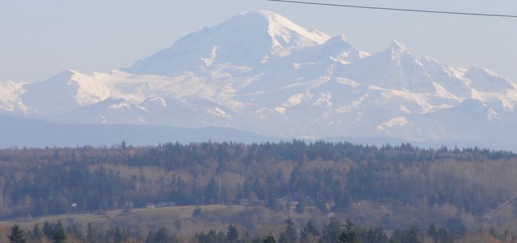 the mountains are covered with snow in the distance, and there is no image to describe