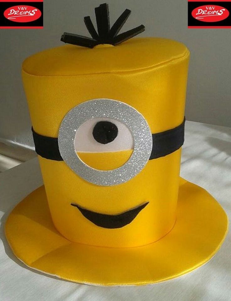 a cake made to look like a minion hat with eyes and ears on top