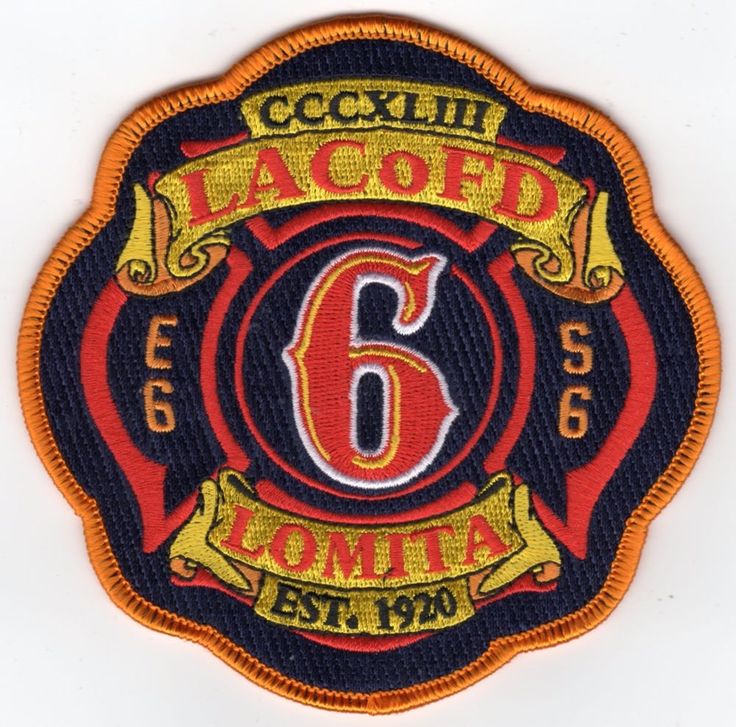 a patch with the number six in red, yellow and black on it's side