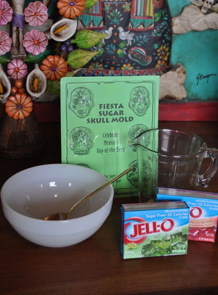 there is a bowl, tea bag and other items on the table next to it