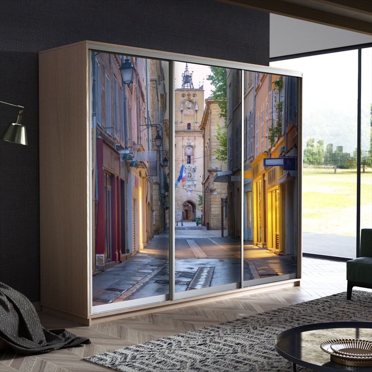 a living room with a large sliding glass door that has an image of a city street on it