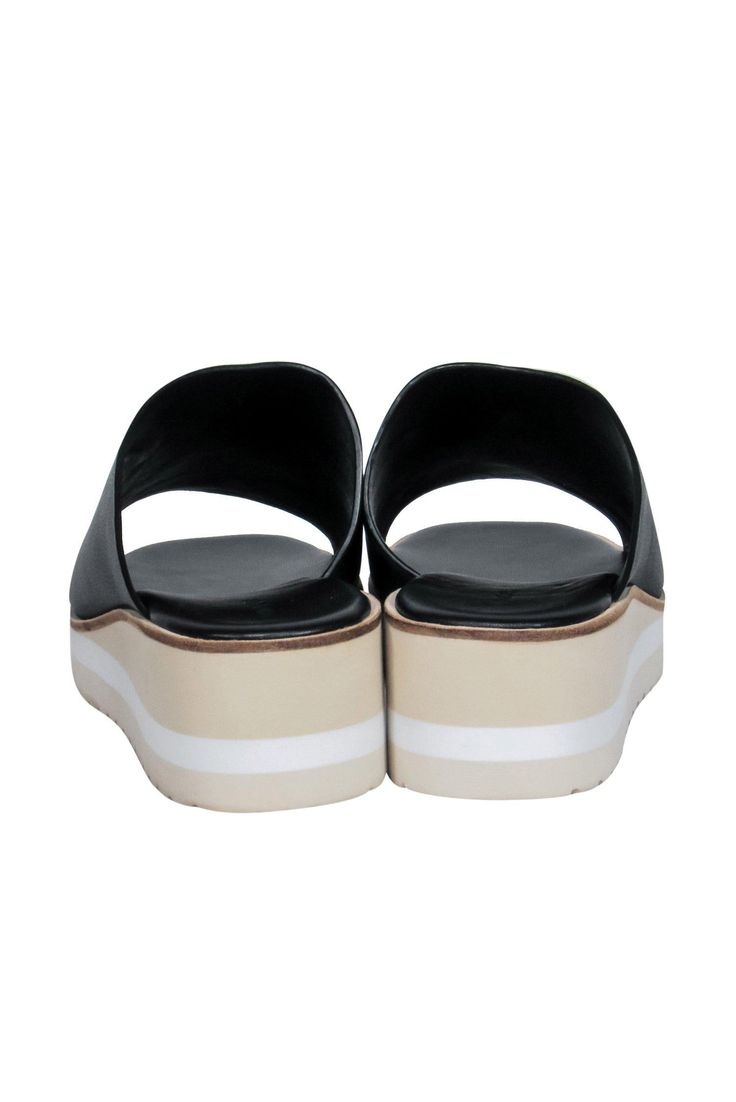 Slip on some easy and breezy summer style with these Vince sandals! The classic slide sandal is elevated (literally!) with a chic striped wedge and platform. Perfect for all your warm weather excursions! Whether you're headed to a post-beach dinner or going shopping downtown with your BFFs, pair these beauties with a maxi dress and your favorite sunnies and you'll be good to go! Size 9 Leather upper Slip on Open back Open toe Striped platform and wedge Leather sole and footbed w/ almost no wear Modern Slip-on Clogs For Summer, Comfortable Wedge Sandals With Platform, Comfortable Platform Slide Wedge Sandals, Comfortable Slide Wedge Sandals With Platform, Black Wedge Heel Clogs For Summer, Summer Leather Platform Slides, Comfortable Platform Slides For Vacation, Leather Platform Slides For Summer, Slip-on Platform Clogs For Summer