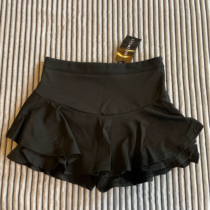 Black / Ruffles / Shorts Under That Also Have Ruffles / Never Worn / Spandex Like Material / Very Comfy Black High Waist Tennis Skirt For Summer, Fitted Elastane Shorts For Night Out, Stretch High Waist Skort For Night Out, High Waist Stretch Skort For Night Out, Stretch Black Tennis Skirt With Elastic Waistband, Black Stretch Tennis Skirt With Elastic Waistband, Casual Party Skort In Elastane, Casual Elastane Skort For Party, High Waist Stretch Tennis Skirt For Party