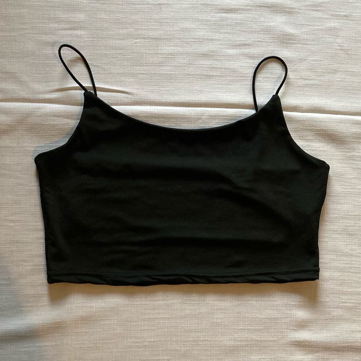 Spaghetti Strap Crop Top Size: Medium Color: Black Top Never Worn. Does Not Have Tags. Excellent Condition. Carefully Look At All The Pictures For Full Description! Black Cami Top With Built-in Bra, Black Stretch Camisole With Spaghetti Straps, Black Summer Tops With Built-in Bra, Black Tank Crop Top With Built-in Bra, Black Cotton Tops With Built-in Bra, Black Seamless Camisole With Spaghetti Straps, Black Seamless Spaghetti Strap Camisole, Casual Black Tops With Straps, Black Stretch Camisole For Summer