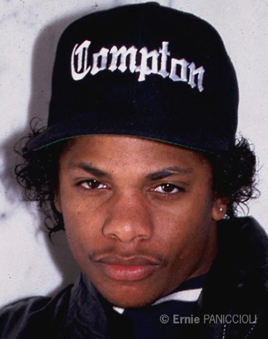 a young man wearing a black hat with the word champion on it's side