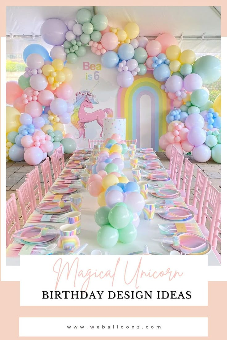 a table set up for a unicorn themed birthday party with balloons and pastel colors