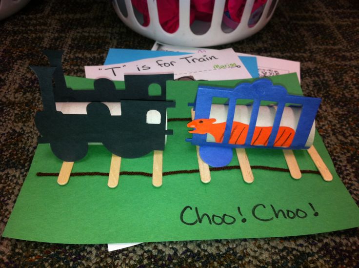 a paper train on top of a green piece of paper with the words choo choo