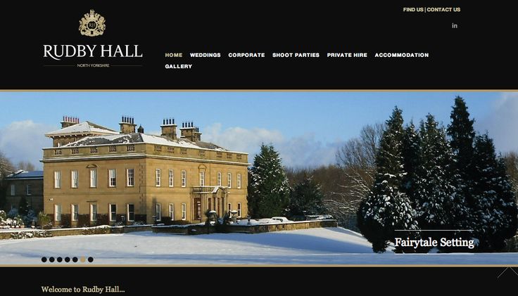 the homepage for ruby hall is shown in black and gold, with snow on the ground