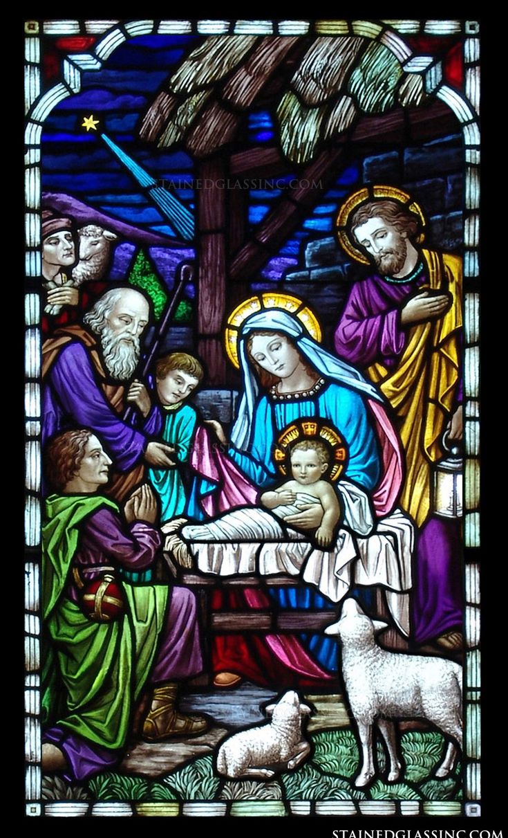 a stained glass window depicting the birth of jesus