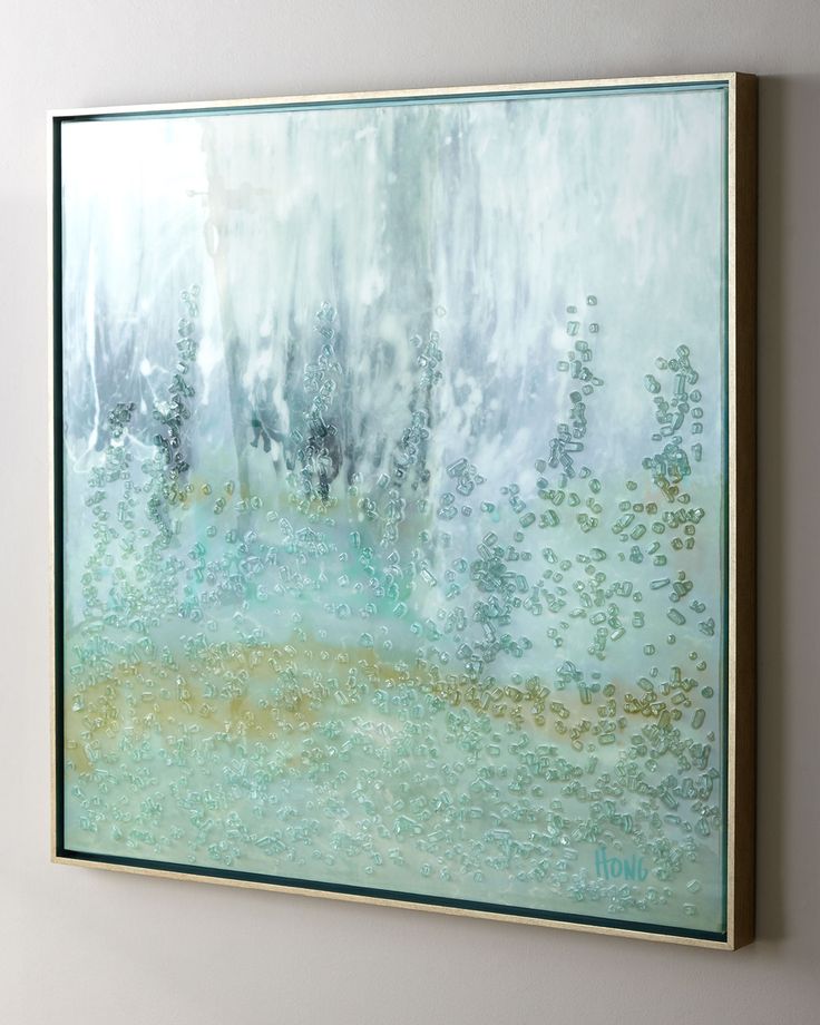 an abstract painting hangs on the wall