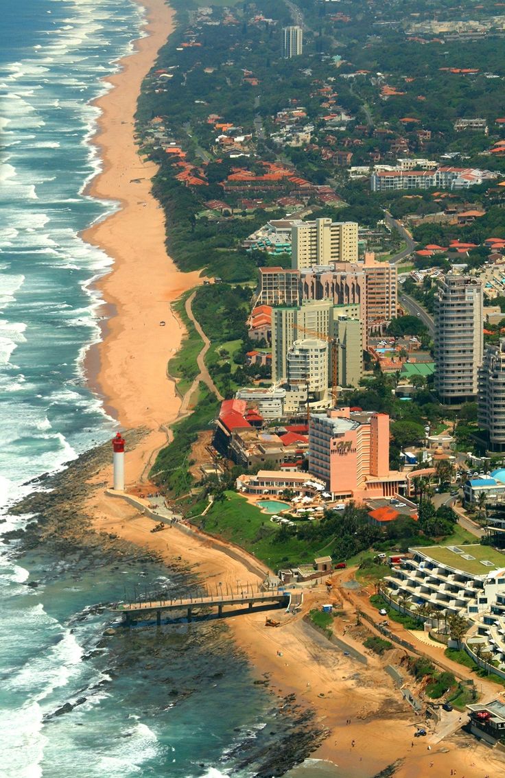 an aerial view of the beach and city