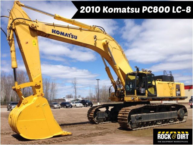 an excavator is parked in the parking lot