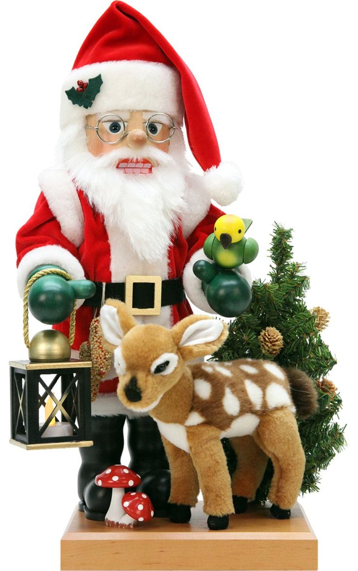 a santa clause is standing next to a small deer