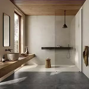 a large bathroom with two sinks and mirrors