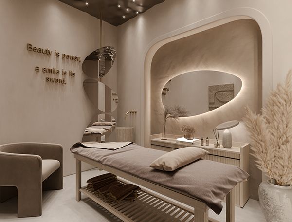 a spa room with a bed, chair and mirror in the corner on the wall