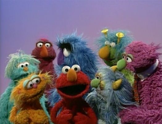 the sesame street characters are posing for a photo