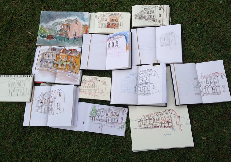 many drawings are laid out on the grass