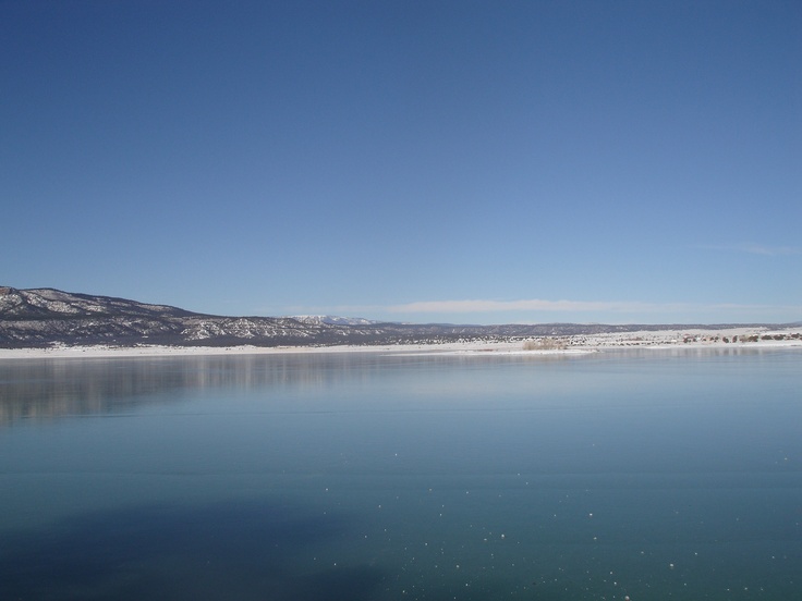 the water is very clear and blue with no clouds on it's sides,