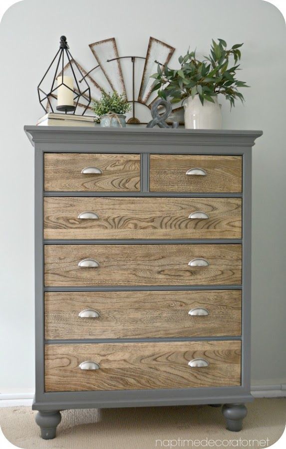 an old dresser has been painted gray and wood