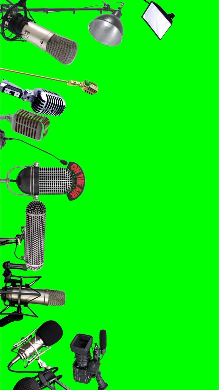 an array of microphones on a green screen