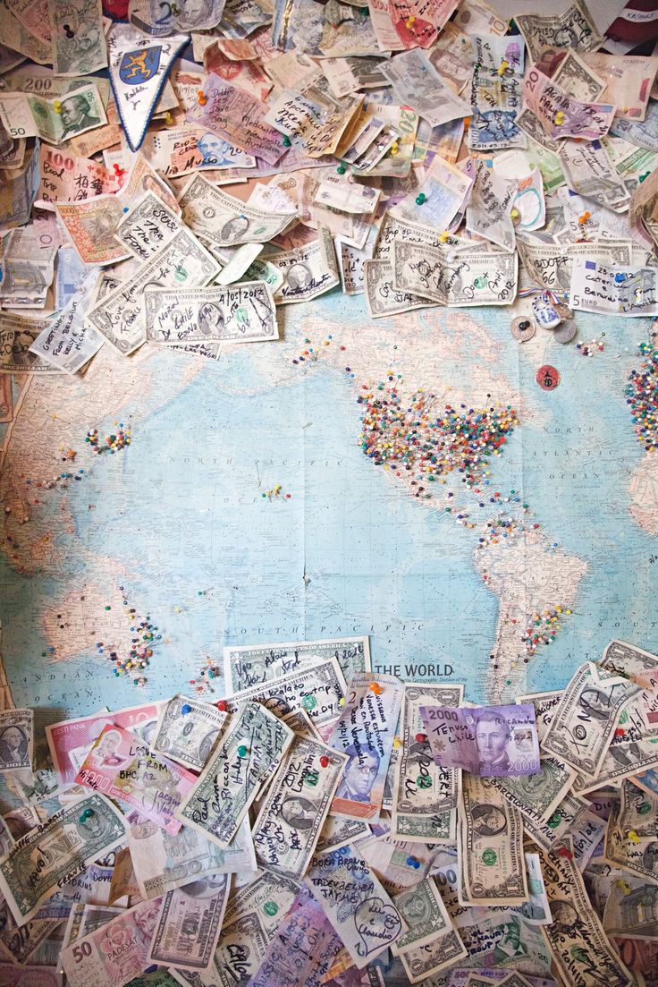 a map covered in lots of money sitting on top of a table