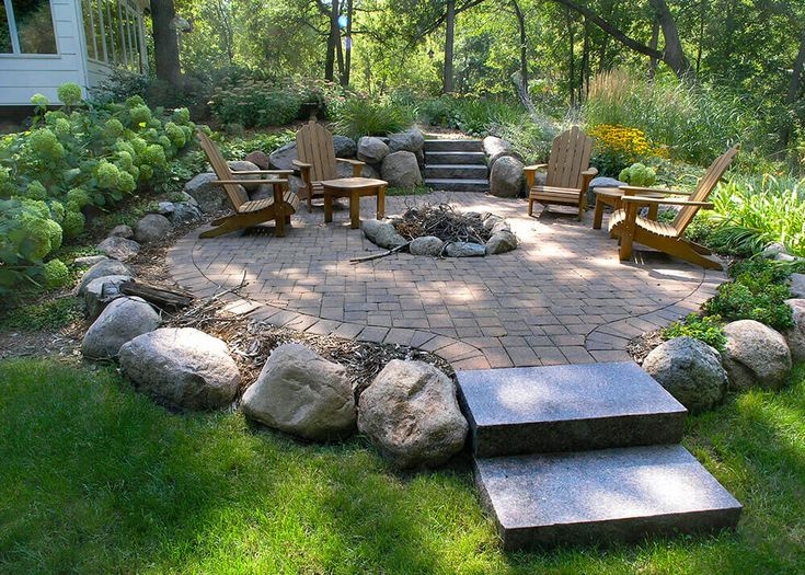 an outdoor patio with steps leading up to it