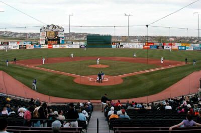 a baseball game in progress with the batter up to plate waiting for the ball to be pitched