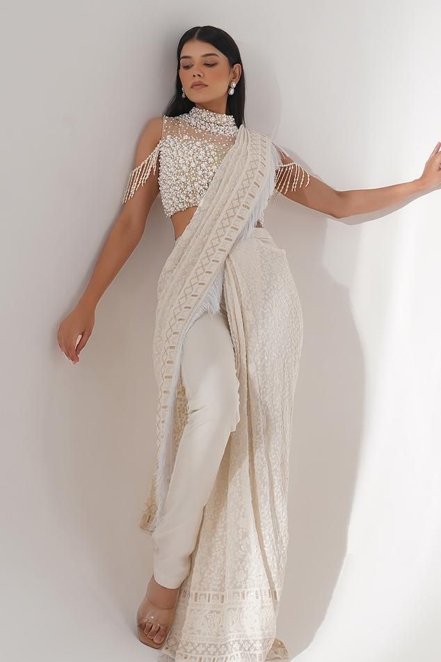 Off white georgette pre-draped saree featuring tonal thread and zari embroidery. Paired with a padded embroidered blouse showcasing pearl, bead, and sequin work., Fit: Relaxed Pant Saree, Dhoti Saree, Draped Saree, Cold Shoulder Sleeves, Zari Embroidery, Drape Saree, Saree And Blouse, Embroidered Blouse, Set For Women