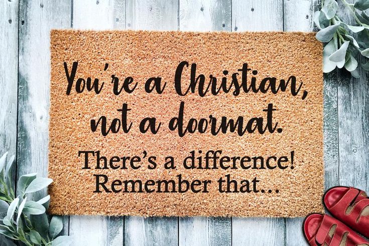 a door mat that says you're a christian, not a dornat