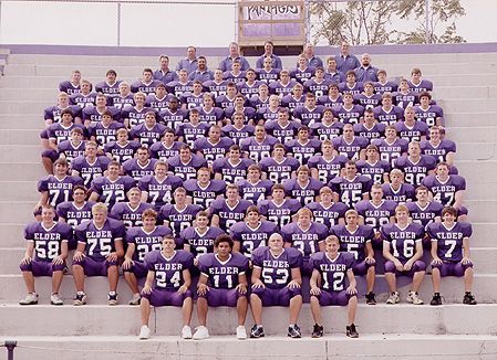 the football team is sitting on the bleachers