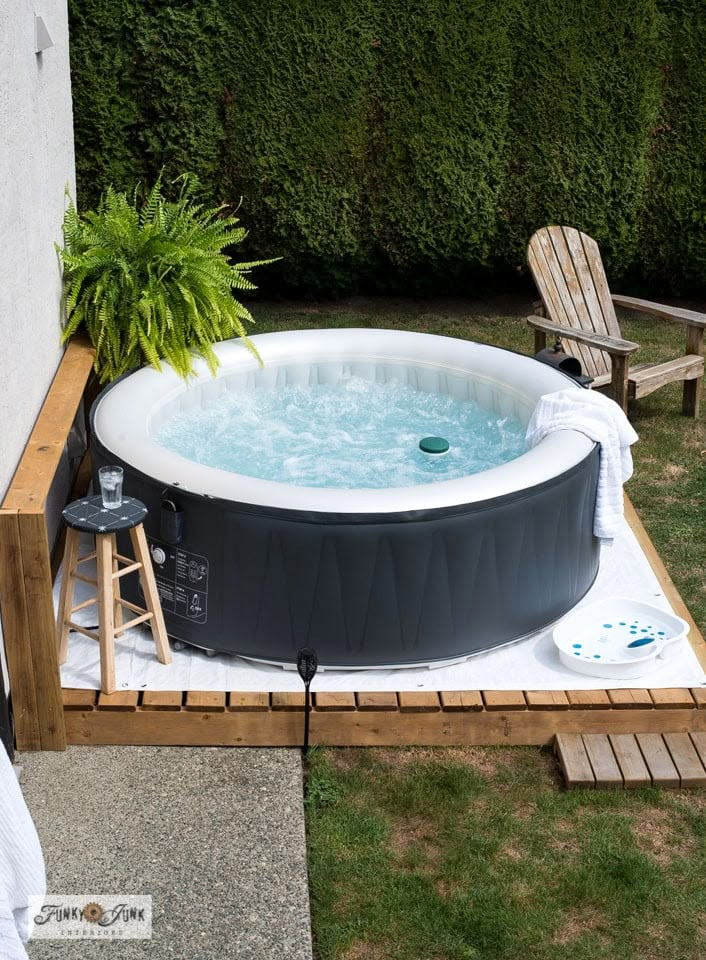 an inflatable hot tub sits on a patio