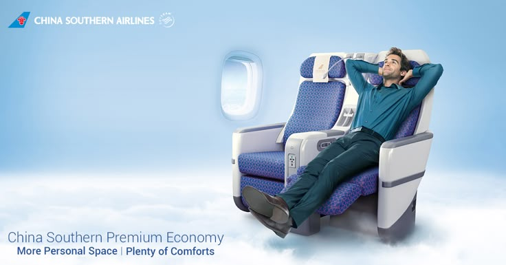 a man sitting on an airplane with his head resting on the seat