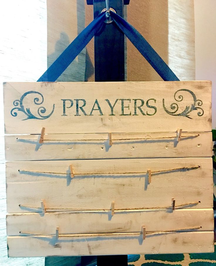 a wooden sign that says prayers on it