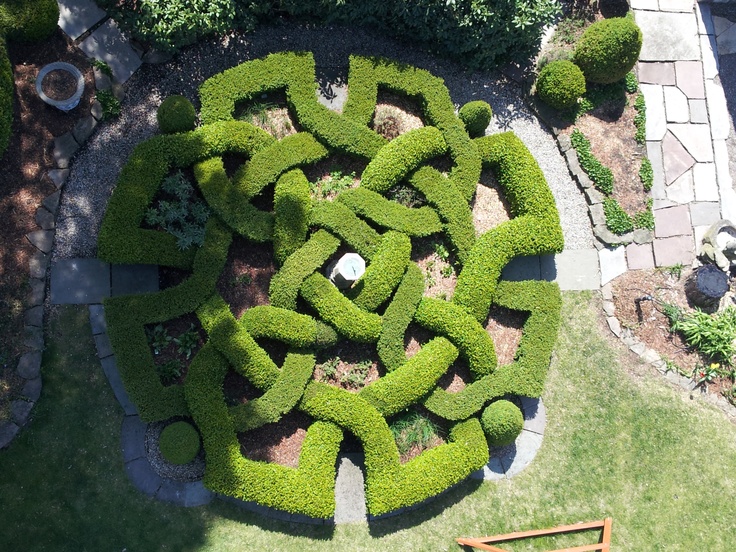 an aerial view of a circular garden design