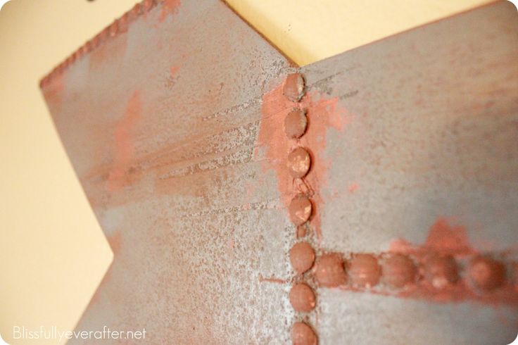 the corner of a wall that has been painted red and is being used as a decorative piece