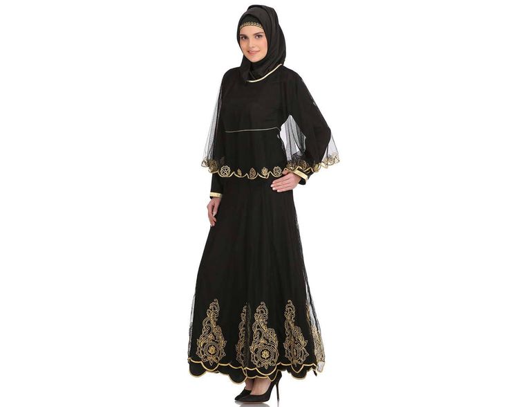 NAZUK BLACK CREPE & NET ABAYA Item Details: Cape design Anarkali style black abaya with golden zari work to give you a mind-blowing and heart catchy looks. -Round neckline with contrast color binding. -Attached embroidered net cape. -Straight sleeves. -Dual layer. -Flared embroidered panels all round for ease of movement. -Matching Square Hijab (100*100 cm) and Band Included. Specifications: Colour: Black Fabric: Crepe, Plain Net & Flower Net (100% polyester) Care: Hand Wash with like colors. Pl Black Bollywood Long Sleeve Gown, Black Bollywood Gown With Long Sleeves, Black Long Sleeve Bollywood Gown, Black Embroidered Long Sleeve Gown, Black Long Sleeve Embroidered Gown, Fitted Black Abaya For Eid, Fitted Embroidered Black Abaya, Black Long Sleeve Gown For Festive Occasions, Semi-stitched Black Gown For Eid