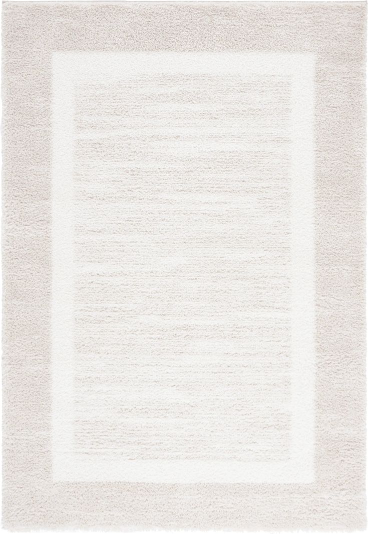 a white rug with a square in the middle