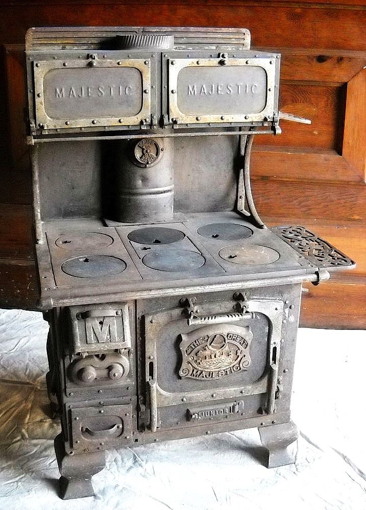 an old fashioned stove with two burners on it