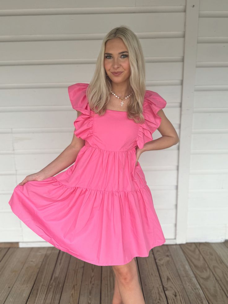 Adorable flowy pink babydoll dress with ruffle sleeves. Model is 5'4" with a 25" waist, 32" bust, and 32" hips wearing a small. Pink Tiered Dress With Ruffle Hem, Casual Pink Tiered Dress With Ruffled Straps, Pink Mini Tiered Ruffled Dress, Pink Ruffled Mini Length Tiered Dress, Pink Ruffled Dress With Short Sleeves, Pink Mini Tiered Dress With Ruffles, Pink Mini Tiered Dress With Ruffled Skirt, Cute Pink Dress With Ruffled Skirt, Pink Short Sleeve Dress With Ruffles