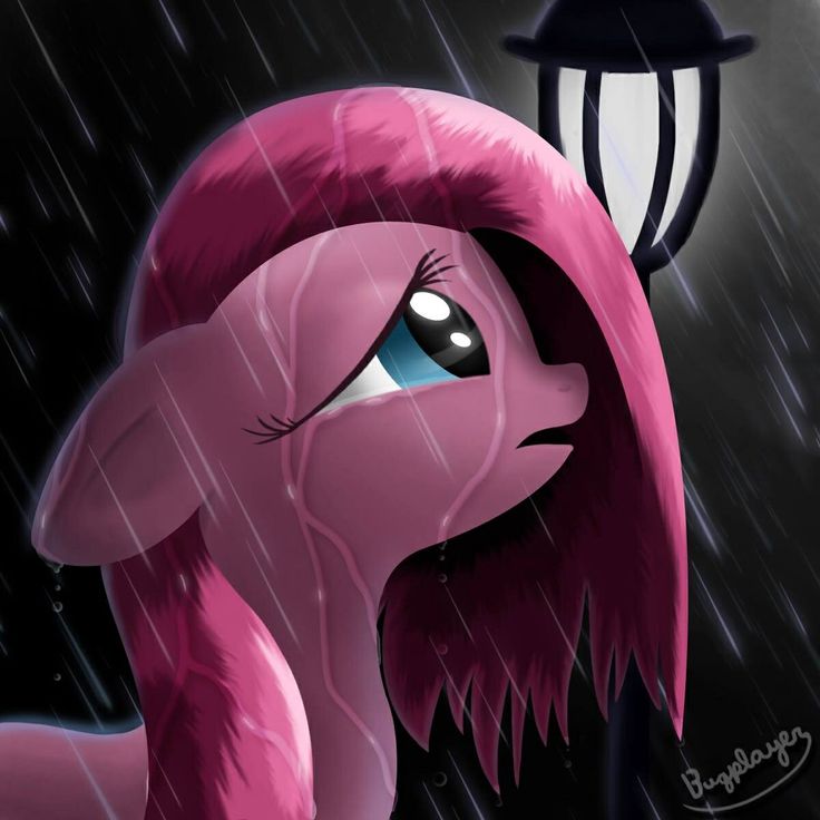 a pink pony is standing in the rain with a light on it's head