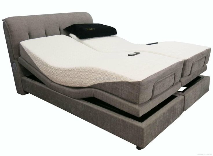 a bed with a pull out mattress on top of it