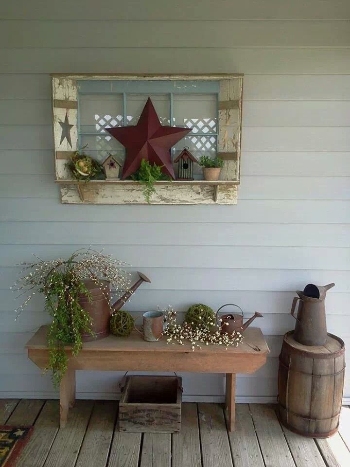 a wooden table topped with potted plants next to a window