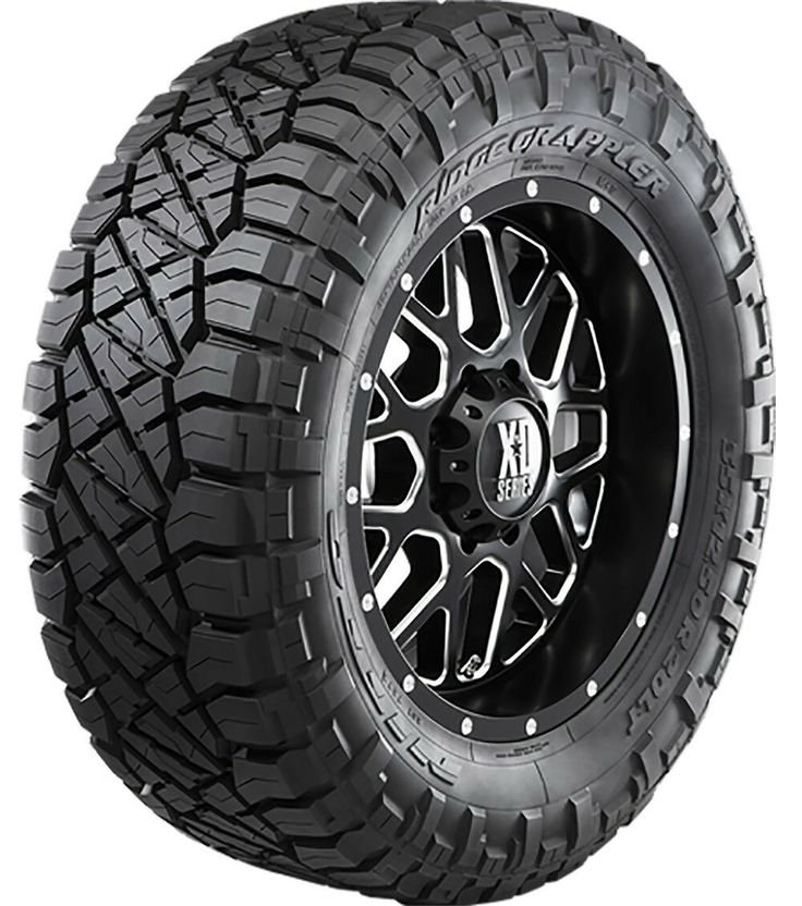 an all terrain truck tire with black spokes and chrome rim, on a white background