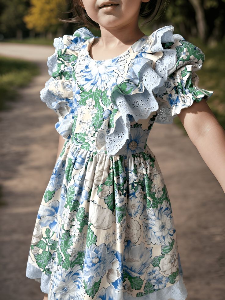 ✿ABOUT THIS DRESS ✓Garden floral pattern twirly dress, crafted with a beautiful poplin fabric and featuring a layered festoon ruffle sleeve, a cotton lining, and a soft blue-green and white color.  ✿FABRIC INFORMATION ✓Natural cotton lining 100% under the skirt, poplin fabric, festoon. ✓Color of your item may vary slightly from what you see on your screen because all monitors display colors differently. ✿SIZES ✓Please check our size diagram on the left picture to find the perfect fit before orde Spring Ruffle Dress For Dress-up, Spring Ruffle Dress For Dress-up Occasions, Spring Tiered Ruffle Dress For Dress-up, Spring Tiered Ruffle Dress For Dress-up Events, Spring Ruffle Dress With Ruffled Skirt For Dress-up, Cute Spring Twirl Dress With Ruffles, Blue Cotton Ruffle Dress For Spring, Spring Blue Cotton Ruffle Dress, Spring Ruffled Twirl Dress For Garden Party