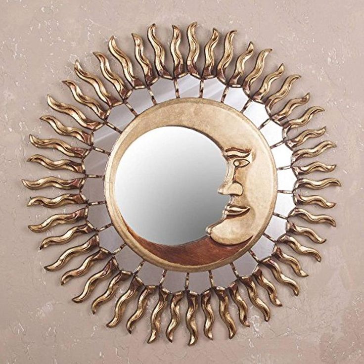 a mirror that is on the wall with sunflowers around it and a man's face