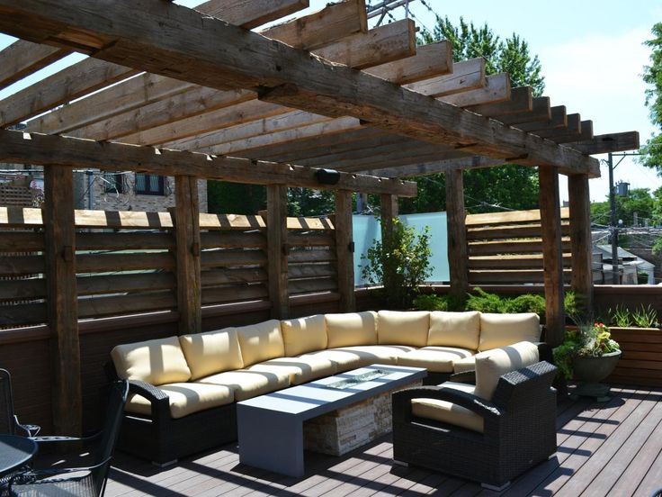 a couch and table on a wooden deck