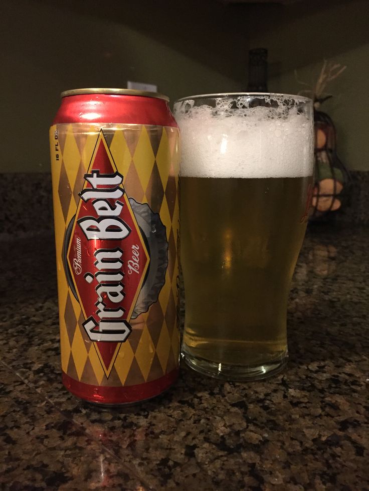 a can of beer sitting on top of a counter