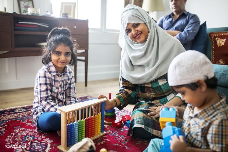 a woman and two children playing with toys